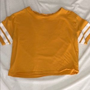 Orange cropped T shirt.